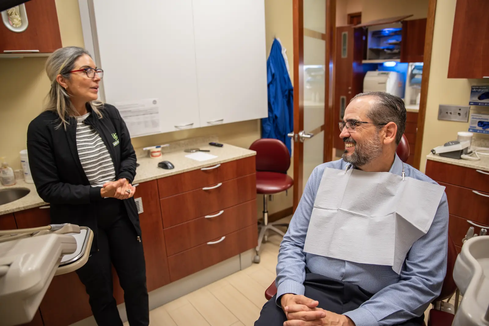Happy and satisfied patient after visiting our dentist in Coral Gables